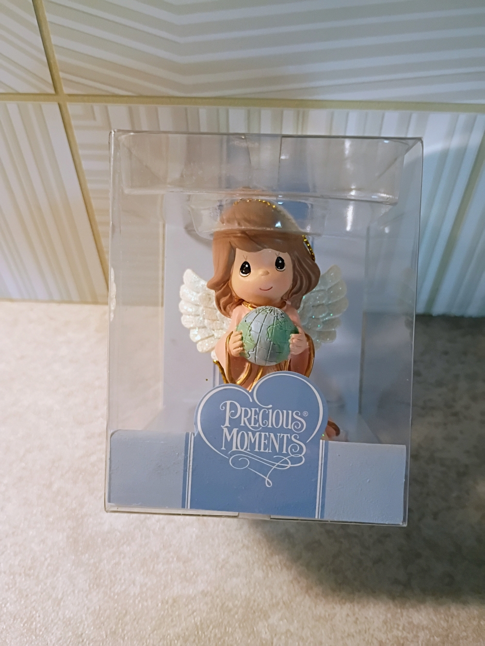 Precious Moments Angel Holding Blue-Green Globe with Cream Robe
